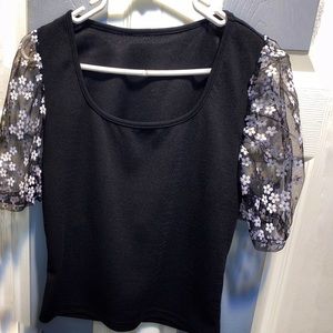 Black crop top, blk net sleeves w/ cute white flowers gold in the center of each